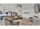 Open-concept living room with large sofa, connecting the kitchen and living spaces, offering a modern design at 1146 Enclave Ct., Auburndale, FL 33823