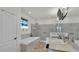Elegant main bathroom featuring a soaking tub, double vanity, and a large marble shower at 1146 Enclave Ct., Auburndale, FL 33823