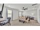 Bright main bedroom with a ceiling fan, sitting area, and ample natural light at 1146 Enclave Ct., Auburndale, FL 33823