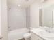 Cozy bathroom with shower over tub, vanity with sink, and tiled walls at 1420 Portmore Dr, Mulberry, FL 33860