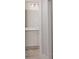Bright bathroom with white cabinets, light countertops, and modern fixtures at 1420 Portmore Dr, Mulberry, FL 33860