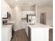 Bright kitchen featuring white cabinets, stainless steel appliances, and a center island at 1420 Portmore Dr, Mulberry, FL 33860