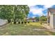 Nice sized backyard area with mature trees providing shade and privacy, perfect for outdoor activities and relaxation at 1423 Ridgegreen N Loop, Lakeland, FL 33809