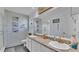 Stylish bathroom featuring double sinks, a vanity, and a walk-in shower at 1423 Ridgegreen N Loop, Lakeland, FL 33809