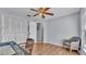 Bedroom featuring wood-look flooring, a ceiling fan and ample natural light at 1423 Ridgegreen N Loop, Lakeland, FL 33809