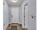 Inviting hallway with neutral paint, closet and a tiled floor that leads to other rooms at 1423 Ridgegreen N Loop, Lakeland, FL 33809