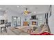 Spacious living room with fireplace, ceiling fan, neutral colors, and sliding glass doors at 1423 Ridgegreen N Loop, Lakeland, FL 33809