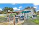 Inviting backyard patio area with comfortable seating, pergola, and well-manicured landscaping offering a relaxing outdoor space at 1423 Ridgegreen N Loop, Lakeland, FL 33809