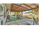 Outdoor patio featuring covered seating area, bar-height table, and backyard at 1423 Ridgegreen N Loop, Lakeland, FL 33809