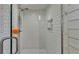 Modern walk-in shower featuring white subway tile and a rain shower head at 1423 Ridgegreen N Loop, Lakeland, FL 33809