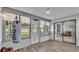 Bright sunroom with wood flooring, a punching bag, and ample windows at 1423 Ridgegreen N Loop, Lakeland, FL 33809