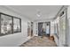 Airy sunroom featuring natural light, wood flooring, and access to the backyard at 1423 Ridgegreen N Loop, Lakeland, FL 33809