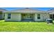 A spacious backyard featuring a covered patio perfect for outdoor enjoyment at 1529 Leamington Ln, Winter Haven, FL 33884