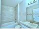 Full bathroom with tiled shower and tub combination with a single sink vanity at 1529 Leamington Ln, Winter Haven, FL 33884