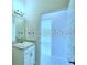 Bathroom featuring vanity with marble countertop and view to the connecting room at 1529 Leamington Ln, Winter Haven, FL 33884