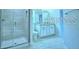 Modern bathroom featuring a glass shower and light-colored vanity at 1529 Leamington Ln, Winter Haven, FL 33884