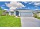 Charming single-story home with a well-manicured lawn and inviting entranceway at 1529 Leamington Ln, Winter Haven, FL 33884