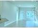 Bright and airy living room with neutral paint and ceramic tile at 1529 Leamington Ln, Winter Haven, FL 33884