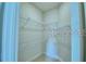 Spacious walk-in closet with wire shelving provides ample storage space for clothing and accessories at 1529 Leamington Ln, Winter Haven, FL 33884