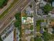 Aerial view of the property showing its location, backyard with pool, and proximity to major roads at 1648 Skinner St, Lakeland, FL 33801