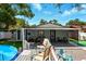 Enjoy this backyard with a covered patio, pool, and ample seating for outdoor relaxation and entertainment at 1648 Skinner St, Lakeland, FL 33801