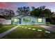 Charming single-story home featuring a manicured lawn and stepping stone walkway at 1648 Skinner St, Lakeland, FL 33801