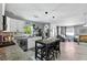 Modern kitchen with white cabinets, stainless steel appliances, and open layout to the living area at 1648 Skinner St, Lakeland, FL 33801