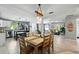 Open-concept living space with dining area flowing into a comfortable living room and bright kitchen at 1648 Skinner St, Lakeland, FL 33801