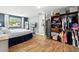 Spacious main bedroom featuring wood floors, closet, and ample natural light at 1648 Skinner St, Lakeland, FL 33801