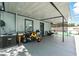 This covered patio features a grill, outdoor furniture, and space for recreational vehicles at 1648 Skinner St, Lakeland, FL 33801