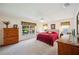 Charming bedroom featuring a comfortable bed and a window with a pleasant outside view at 188 Morning Dew Ct, Winter Haven, FL 33884