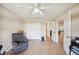 Inviting room featuring a comfortable chair, closet, and entry to the living area at 188 Morning Dew Ct, Winter Haven, FL 33884