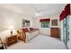 Relaxing bedroom with a comfortable daybed and a window offering a tranquil view at 188 Morning Dew Ct, Winter Haven, FL 33884