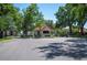 Gated community entrance with lush landscaping, providing security and privacy at 188 Morning Dew Ct, Winter Haven, FL 33884