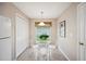 Bright breakfast nook features a glass-top table, tile floors, and a large window with a garden view at 188 Morning Dew Ct, Winter Haven, FL 33884