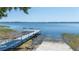 Community dock with ramp access to the lake, seating for two, and picturesque views at 188 Morning Dew Ct, Winter Haven, FL 33884