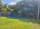 Spacious and well-kept backyard enclosed by a chain link fence, offering privacy and security at 2005 Blue Lake Dr, Lakeland, FL 33801