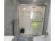 Bathroom showcasing a modern glass-enclosed shower, toilet and towel racks at 2005 Blue Lake Dr, Lakeland, FL 33801