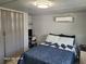 Comfortable bedroom with a double bed, and a built-in desk area with a computer at 2005 Blue Lake Dr, Lakeland, FL 33801