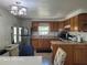 Open-concept kitchen and dining area with stainless steel appliances, and ample counter space at 2005 Blue Lake Dr, Lakeland, FL 33801