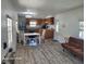 Open-concept kitchen and living area with wood-look floors and abundant natural light at 2005 Blue Lake Dr, Lakeland, FL 33801