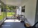 A screened in porch with a bike and small table at 2005 Blue Lake Dr, Lakeland, FL 33801