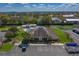 Community clubhouse with parking, pool, and lush landscaping at 2025 Sylvester Rd # P4, Lakeland, FL 33803