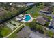 Overhead shot of a community pool, shuffleboard courts, and parking at 2025 Sylvester Rd # P4, Lakeland, FL 33803