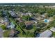 An aerial view of cozy townhomes with a pond and manicured green spaces at 2025 Sylvester Rd # P4, Lakeland, FL 33803