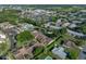 Extensive aerial view of community, showing pool, pond, and surrounding greenery at 2025 Sylvester Rd # P4, Lakeland, FL 33803