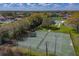 Aerial view featuring community tennis courts, a pool, and well-maintained landscaping at 2025 Sylvester Rd # P4, Lakeland, FL 33803