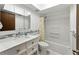 Bathroom featuring a tub and shower, tiled backsplash, and vanity with undermount sink at 2025 Sylvester Rd # P4, Lakeland, FL 33803