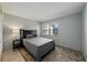 Bedroom featuring a full bed, patterned rug, and a window letting in natural light at 2025 Sylvester Rd # P4, Lakeland, FL 33803