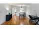 Bright dining area featuring wood floors, and view of the kitchen at 2025 Sylvester Rd # P4, Lakeland, FL 33803